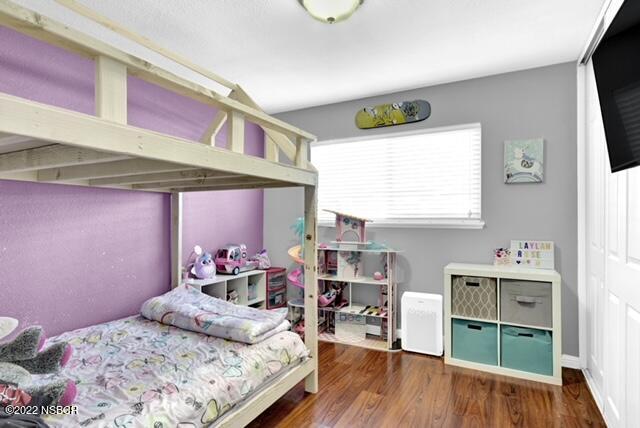 3436 Via Cortez Lompoc, CA 93436 - Photo 8 of 17 a bedroom with a bed and a flat tv screen on dresser