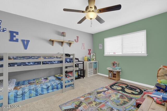 3436 Via Cortez Lompoc, CA 93436 - Photo 10 of 17 a bed room with a bed and a chandelier