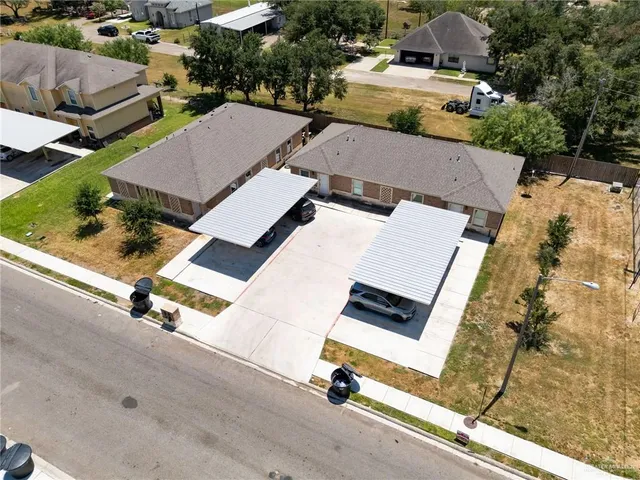 an aerial view of residential house with parking space