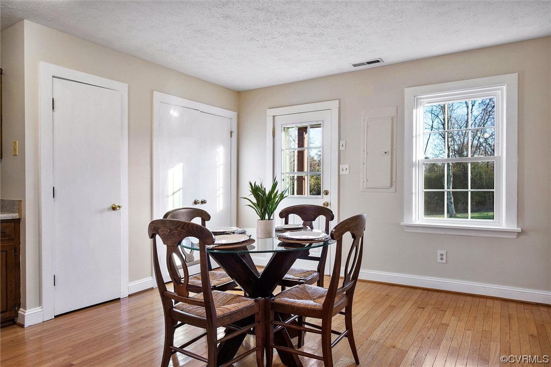 378 Three Chopt Road Manakin-Sabot, VA 23103 - Photo 18 of 34 a view of a dining room with furniture and wooden floor