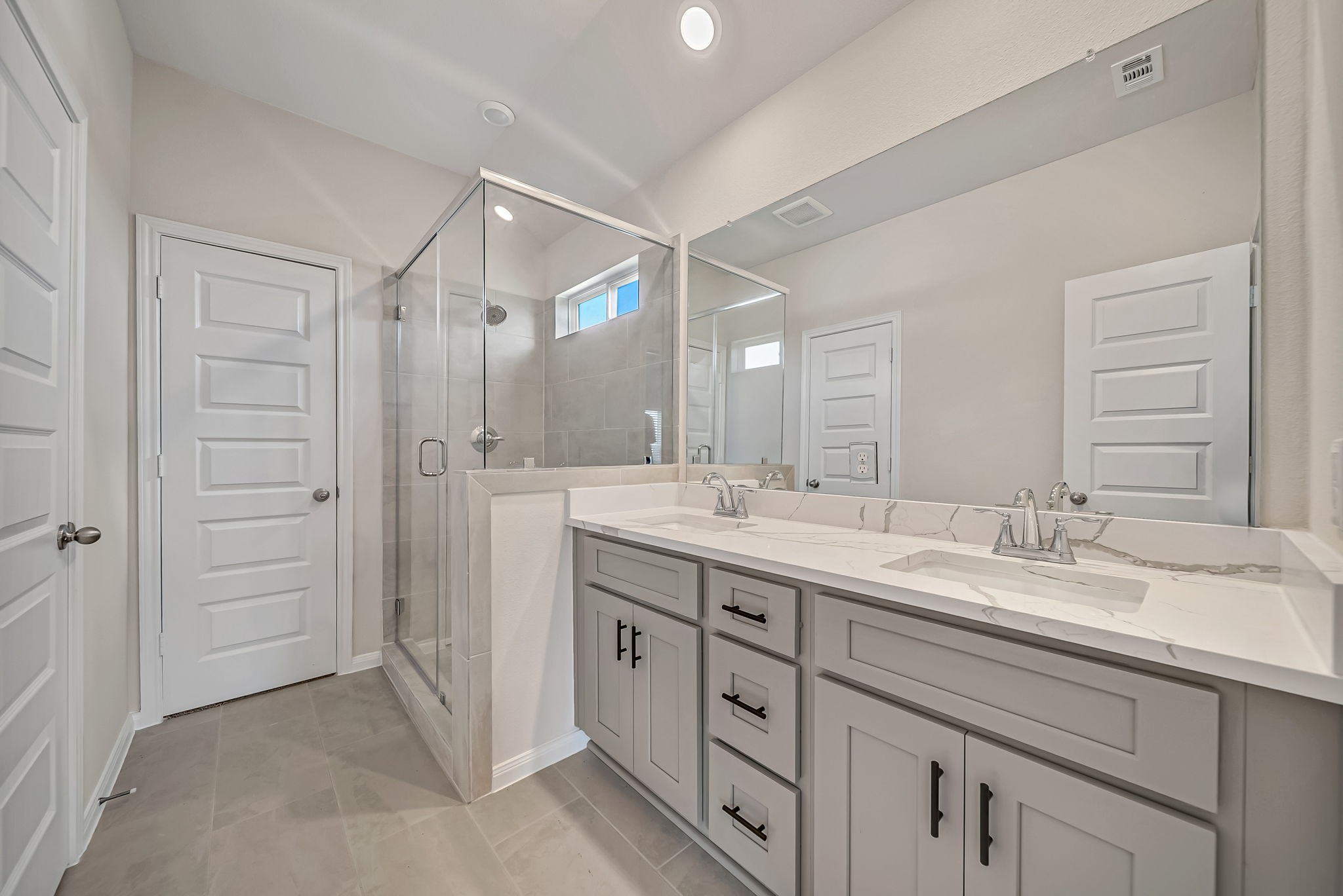 20629 Dynamic Court Humble, TX 77338 - Photo 18 of 26 a spacious bathroom with a double vanity sink mirror and double