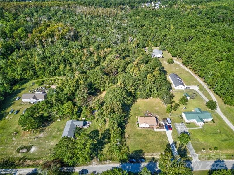 110 Unknown Name Road Southeast Leland, NC 28451 - Photo 24 of 27 an aerial view of a residential houses with outdoor space and trees all around