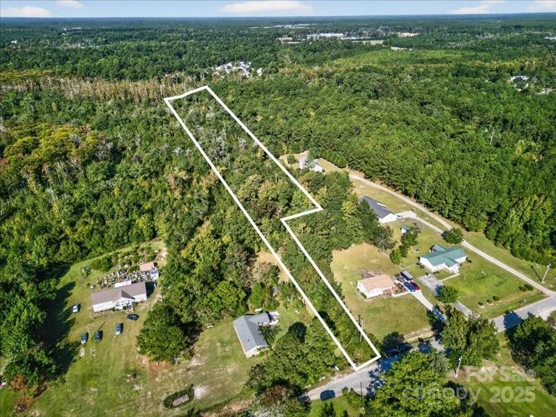 110 Unknown Name Road Southeast Leland, NC 28451 - Photo 25 of 27 an aerial view of a residential houses with outdoor space and street view