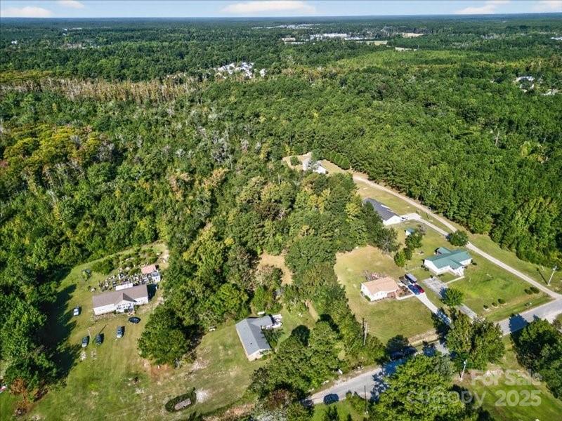 110 Unknown Name Road Southeast Leland, NC 28451 - Photo 26 of 27 an aerial view of residential houses with outdoor space and trees all around