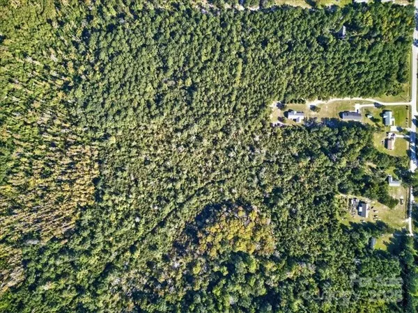 a view of a house with a tree