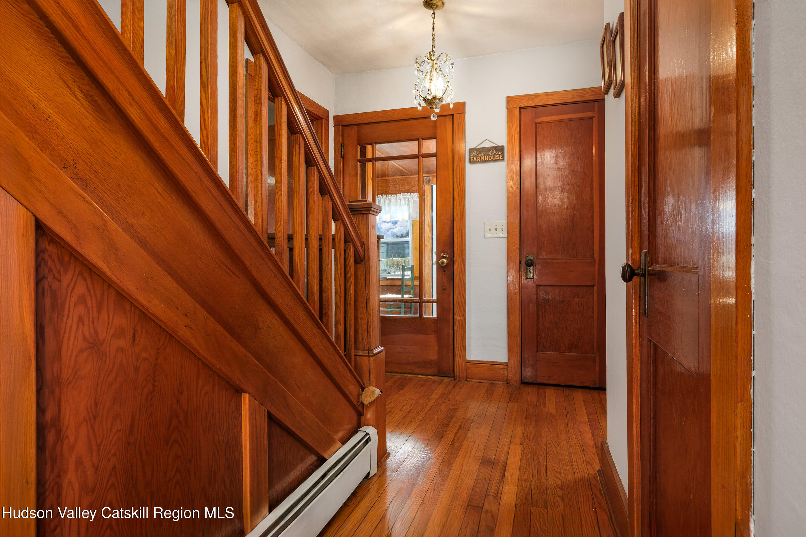 802 County Highway 3A Unadilla, NY 13849 - Photo 11 of 65 a view of a hallway with wooden floor and staircase