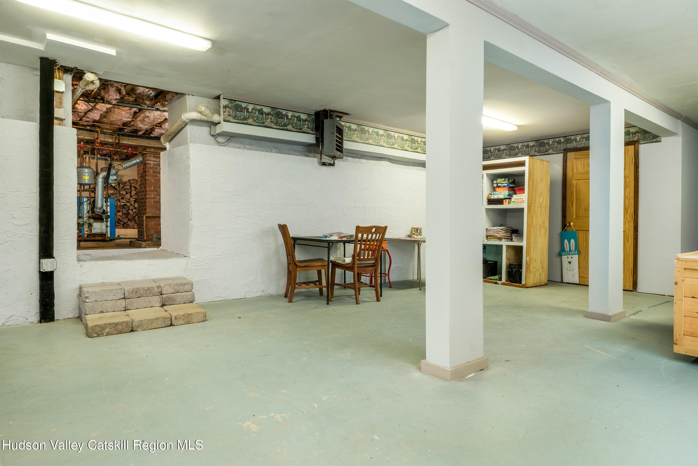 802 County Highway 3A Unadilla, NY 13849 - Photo 45 of 65 a view of a livingroom with furniture and a refrigerator