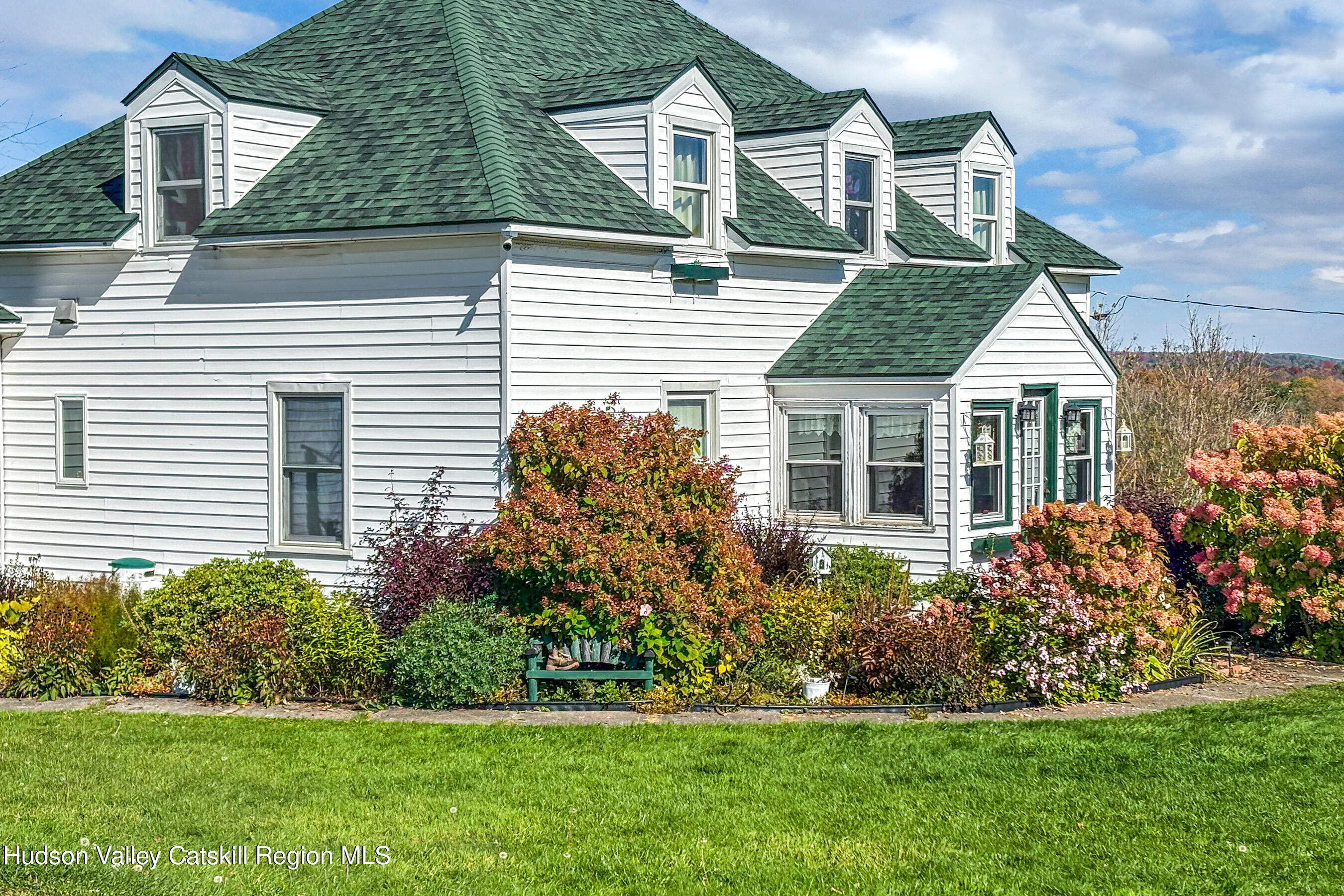 802 County Highway 3A Unadilla, NY 13849 - Photo 51 of 65 a front view of a house with a garden and plants