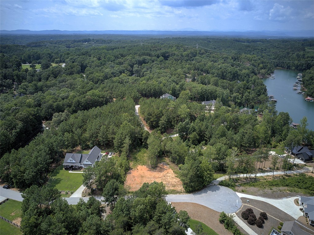 Lot 24 Reservoir Road West Union, SC 29696 - Photo 15 of 46 Discover a tranquil lakeside community with wooded lots and exclusive water access.