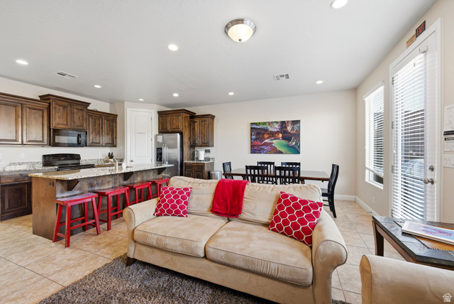 4269 Razor Drive Washington, UT 84780 - Photo 13 of 50 Living room featuring light tile patterned floors and recessed lighting