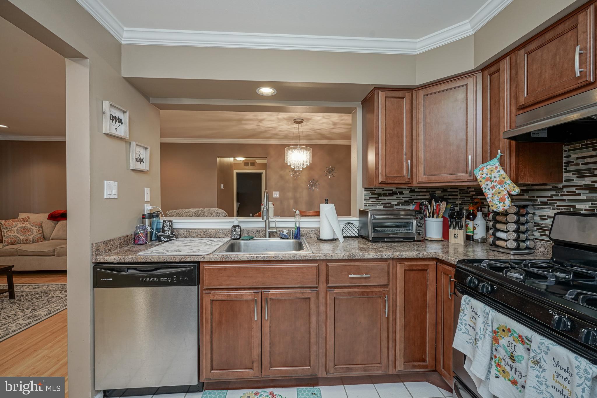 307 Wharton Road Mount Laurel, NJ 08054 - Photo 7 of 14 a kitchen with stainless steel appliances granite countertop a sink stove and cabinets