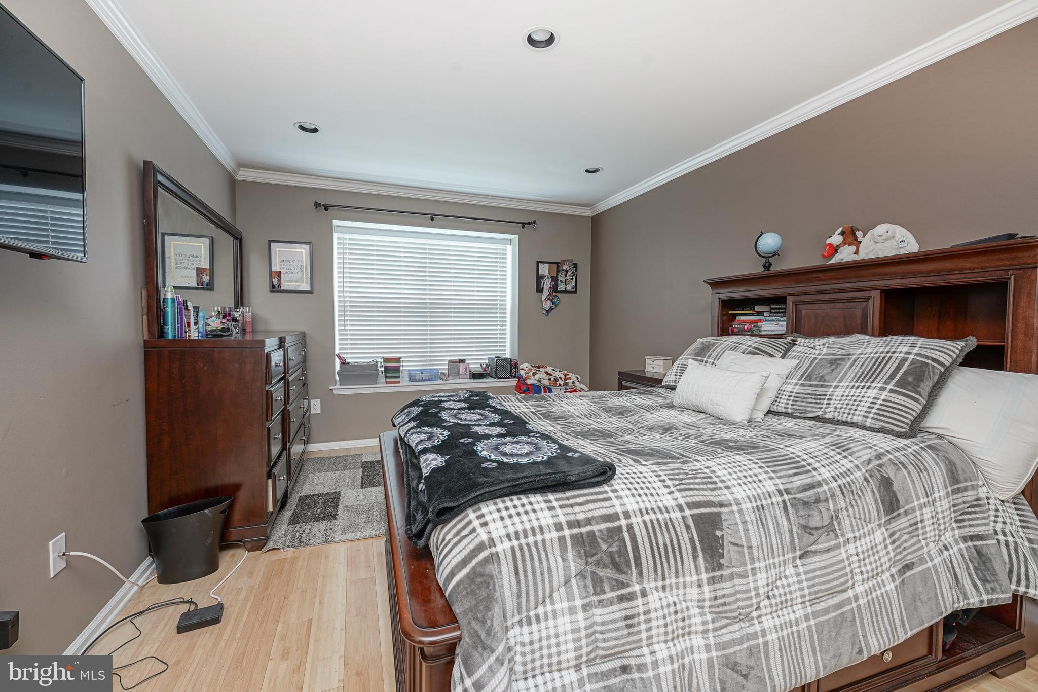 307 Wharton Road Mount Laurel, NJ 08054 - Photo 10 of 14 a bedroom with a bed and a dresser next to a window