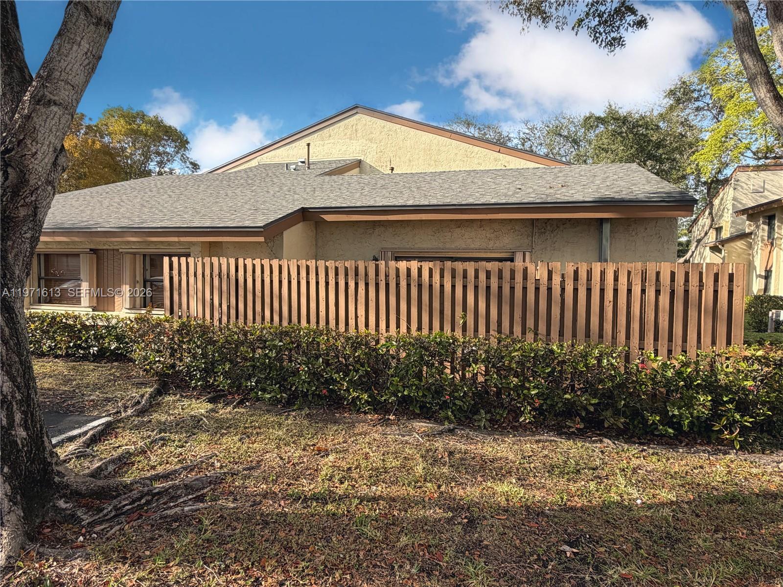 11535 Southwest 109th Road, Unit 22A Miami, FL 33176 - Photo 3 of 41 Side of unit with second fenced in patio - New roof 2024!