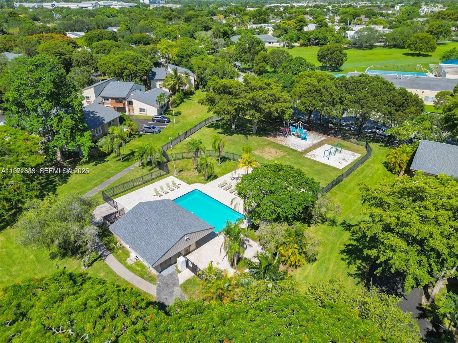 11535 Southwest 109th Road, Unit 22A Miami, FL 33176 - Photo 41 of 41 Secondary Community Pool and Playground steps from unit
