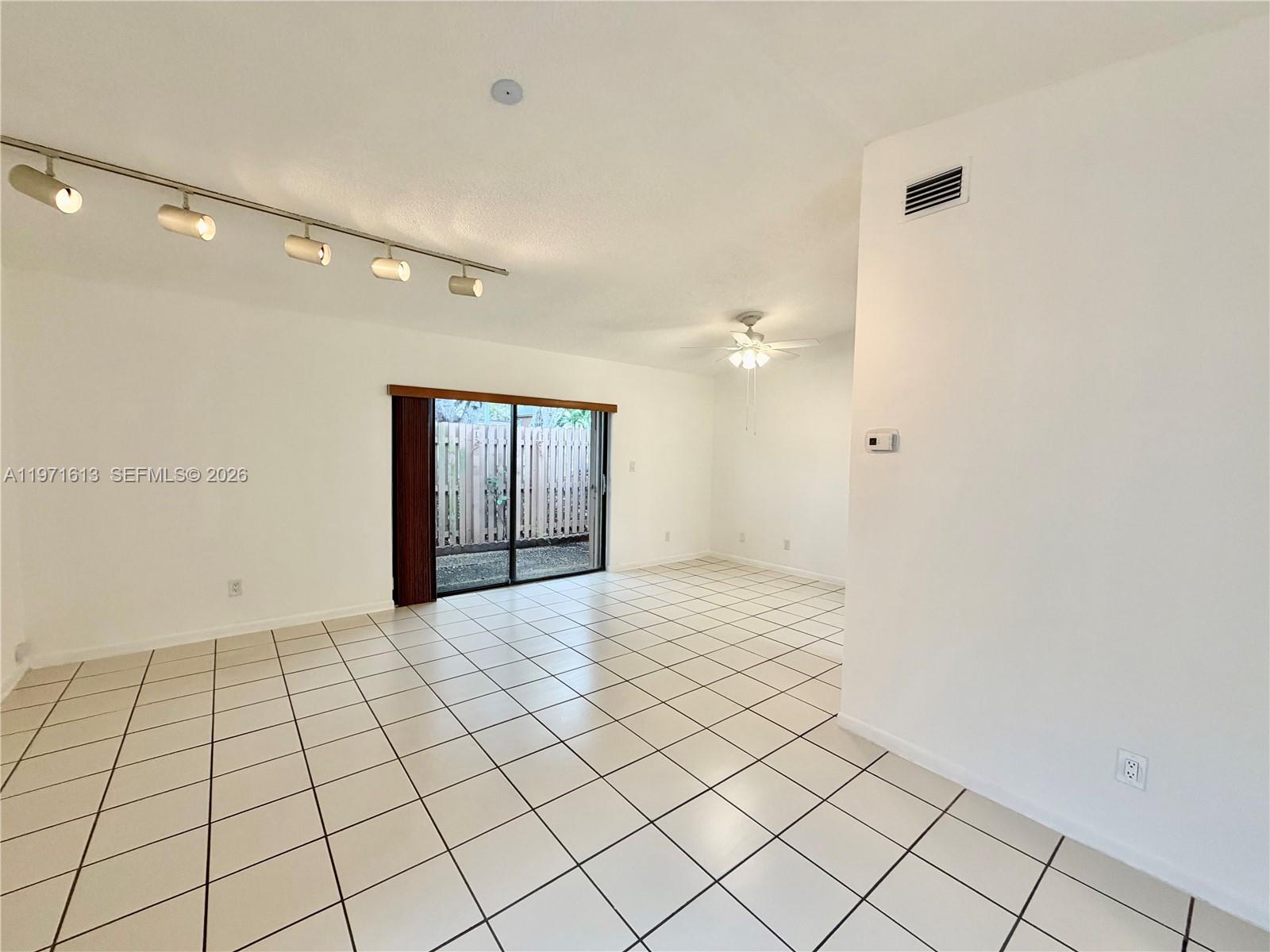 11535 Southwest 109th Road, Unit 22A Miami, FL 33176 - Photo 6 of 41 Living/Dining Area with access to fenced in patio