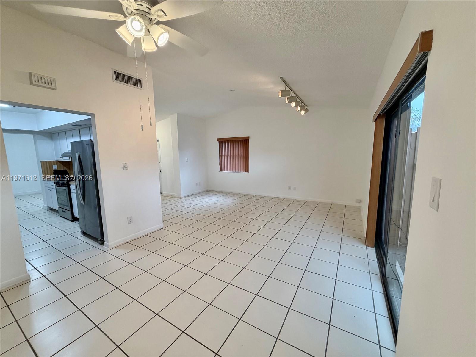 11535 Southwest 109th Road, Unit 22A Miami, FL 33176 - Photo 7 of 41 Dining Area flowing to living room and kitchen