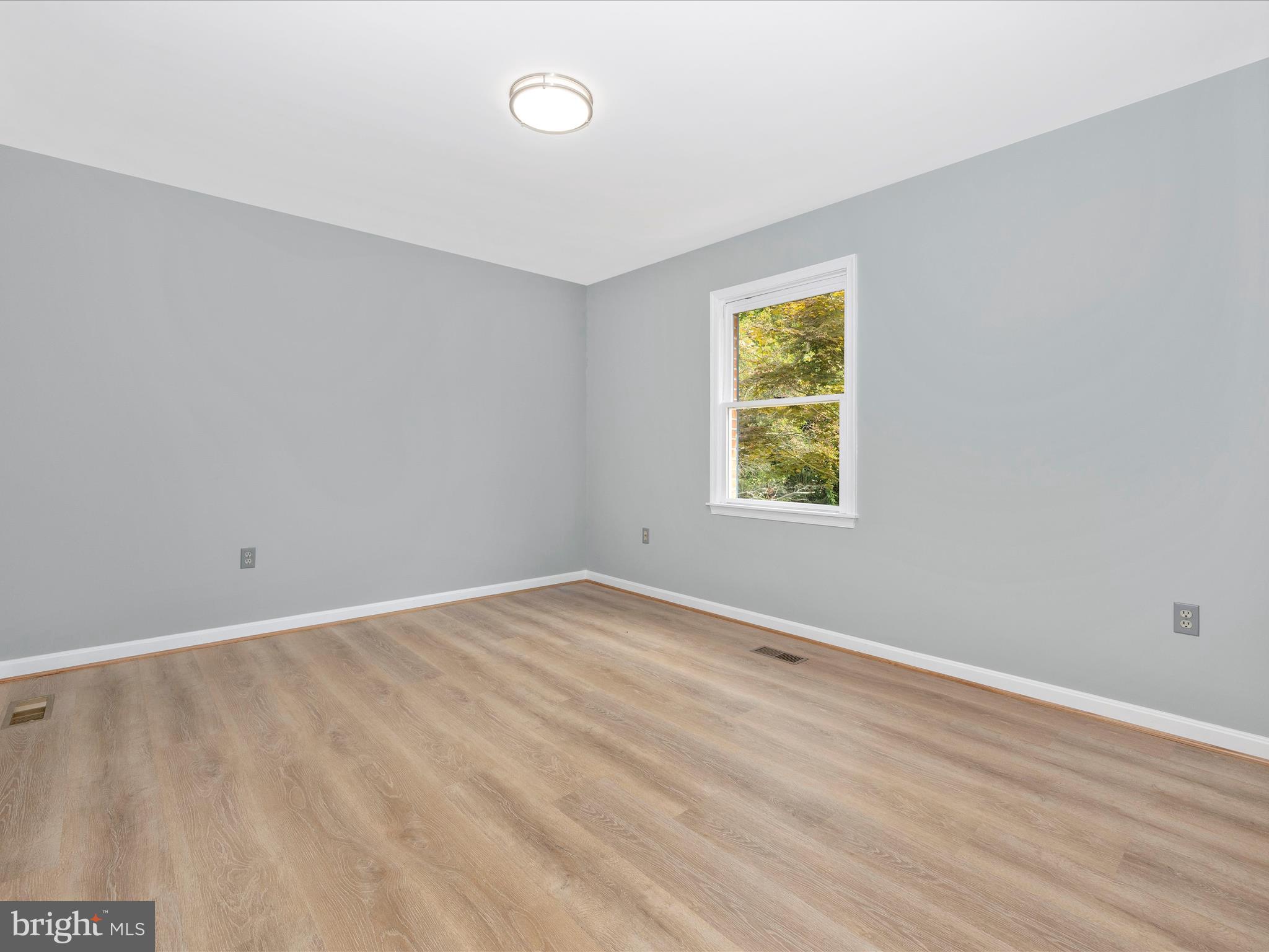 5154 Perry Road Mount Airy, MD 21771 - Photo 24 of 53 wooden floor in an empty room with a window