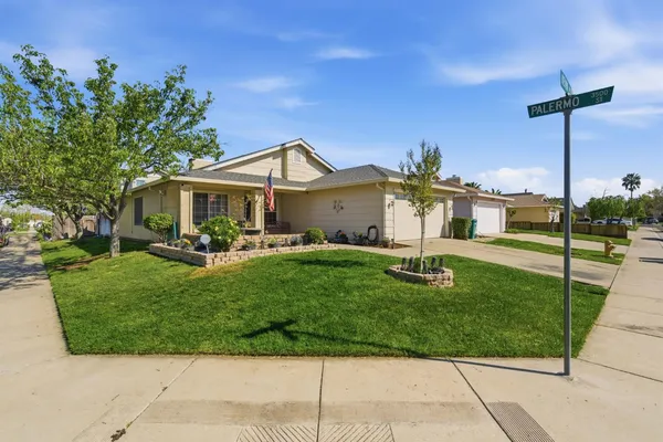 a front view of a house with a yard