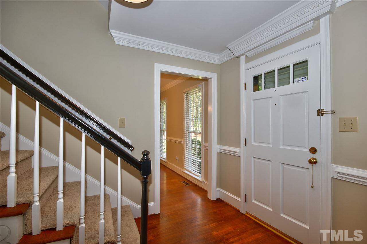 304 Key Court Raleigh, NC 27614 - Photo 2 of 25 a view of an entryway with wooden floor and door