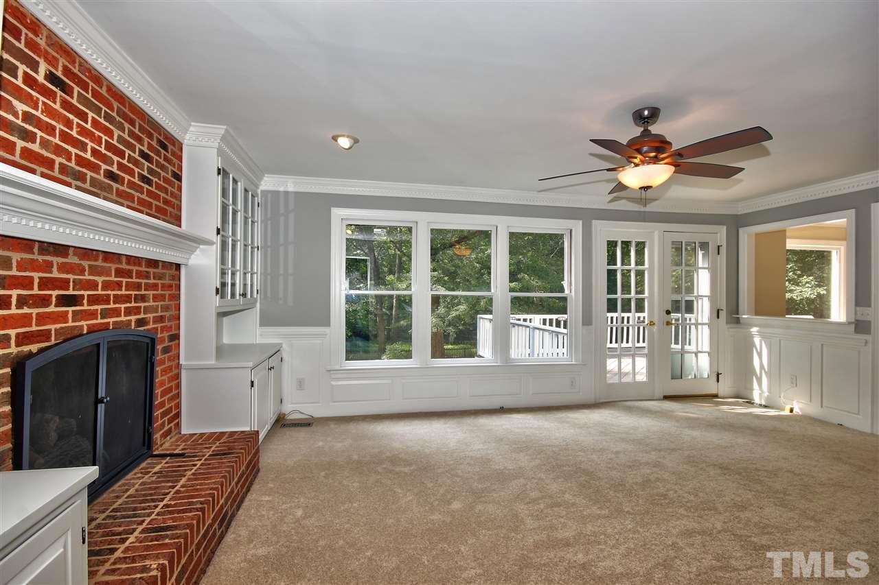 304 Key Court Raleigh, NC 27614 - Photo 11 of 25 a large bedroom with a large bed and a large window