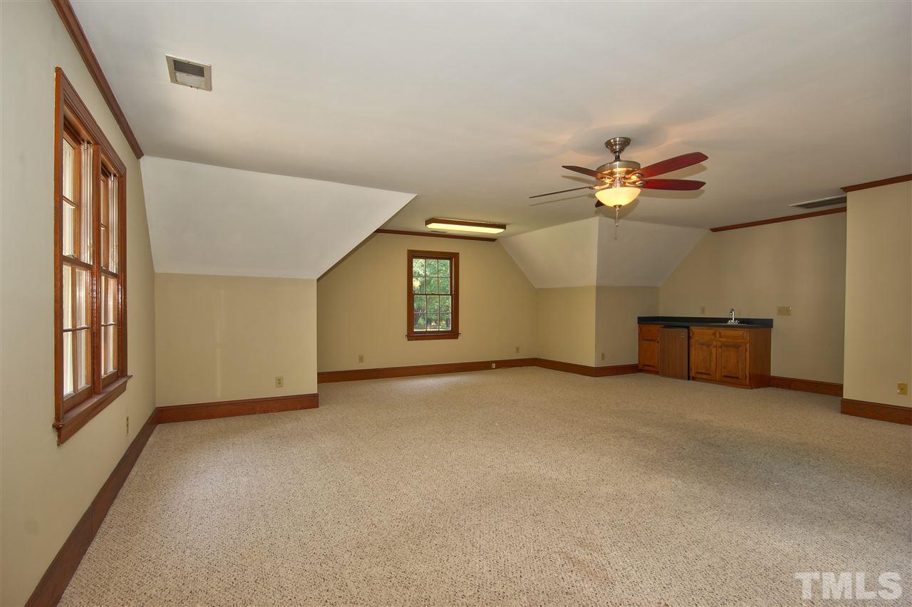 304 Key Court Raleigh, NC 27614 - Photo 18 of 25 an empty room with windows and chandelier fan