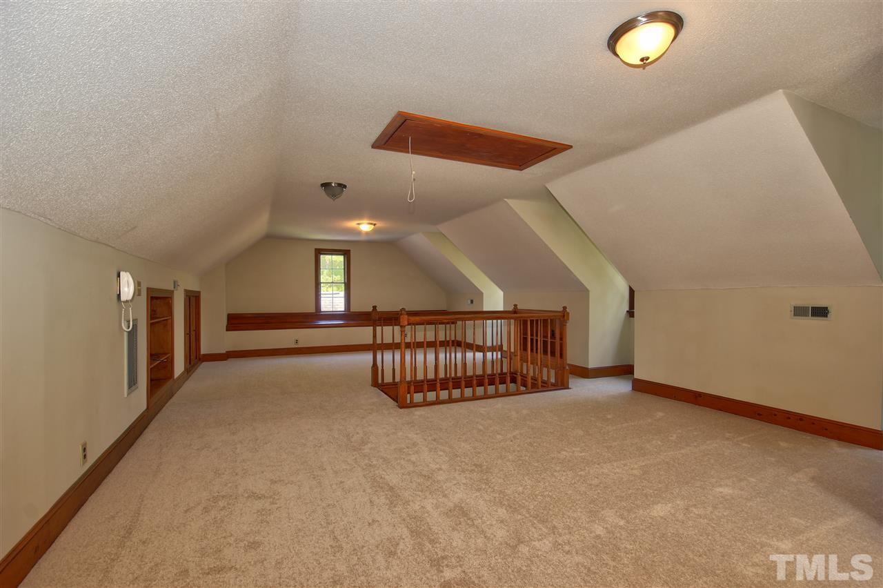 304 Key Court Raleigh, NC 27614 - Photo 20 of 25 a view of an empty room with stairs and a window