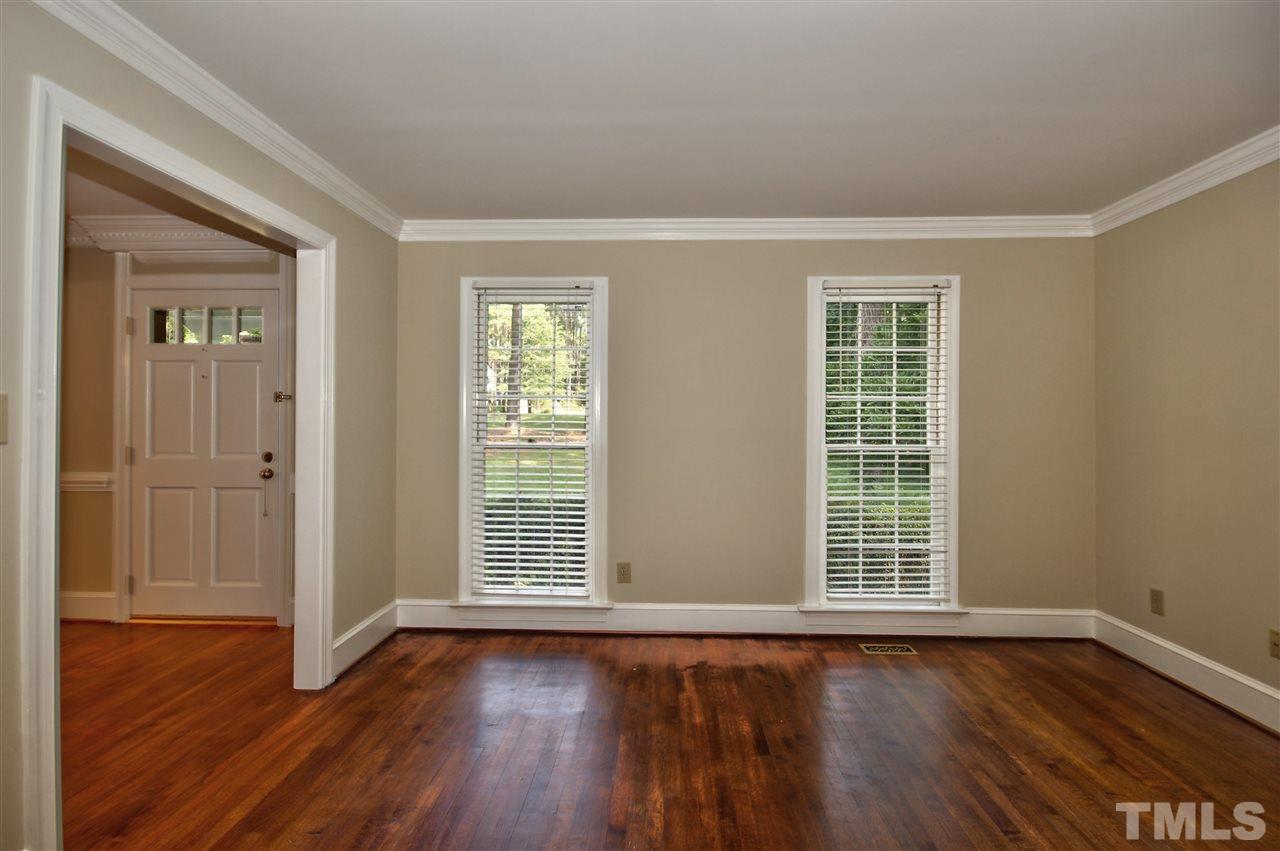 304 Key Court Raleigh, NC 27614 - Photo 3 of 25 wooden floor in an empty room with a window
