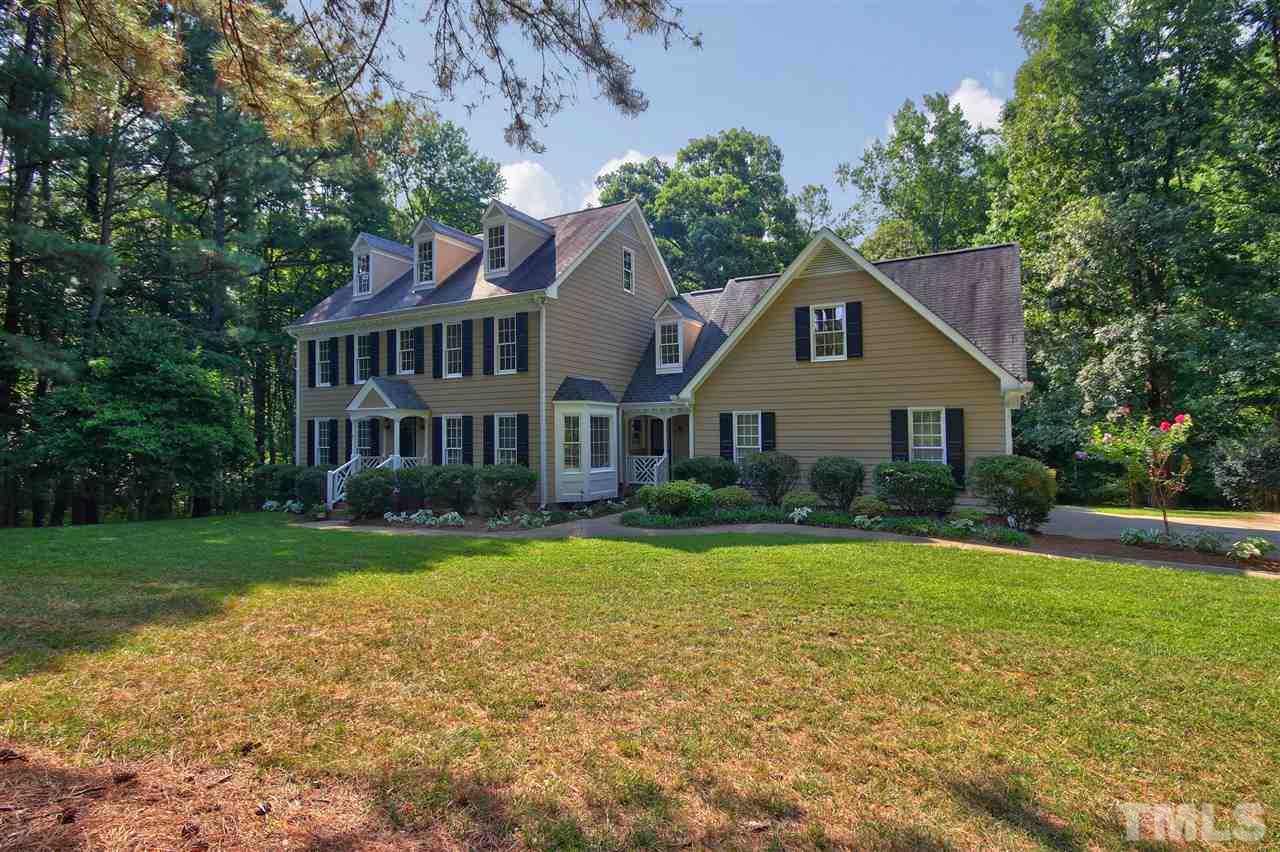 304 Key Court Raleigh, NC 27614 - Photo 24 of 25 a front view of a house with a yard and trees