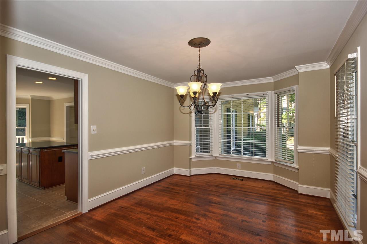 304 Key Court Raleigh, NC 27614 - Photo 6 of 25 a view of a livingroom with wooden floor and kitchen
