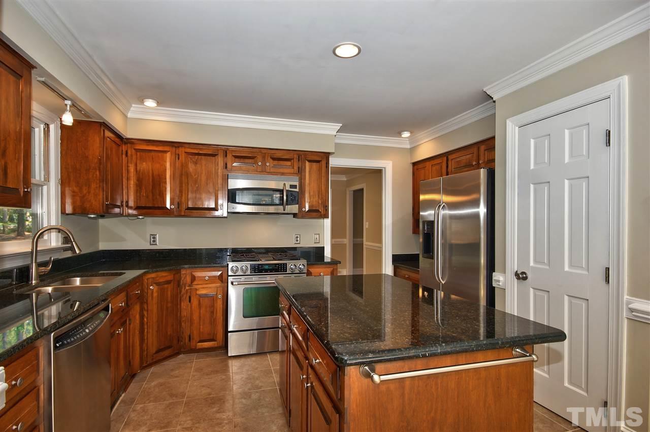 304 Key Court Raleigh, NC 27614 - Photo 8 of 25 a kitchen with stainless steel appliances granite countertop a stove a sink dishwasher and a refrigerator
