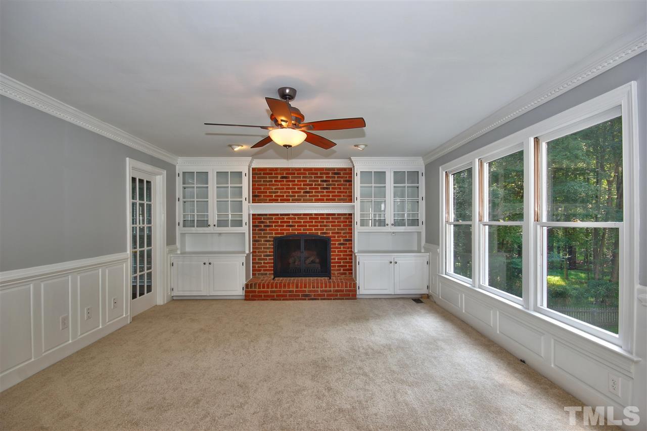 304 Key Court Raleigh, NC 27614 - Photo 10 of 25 a view of a livingroom with a fireplace and window