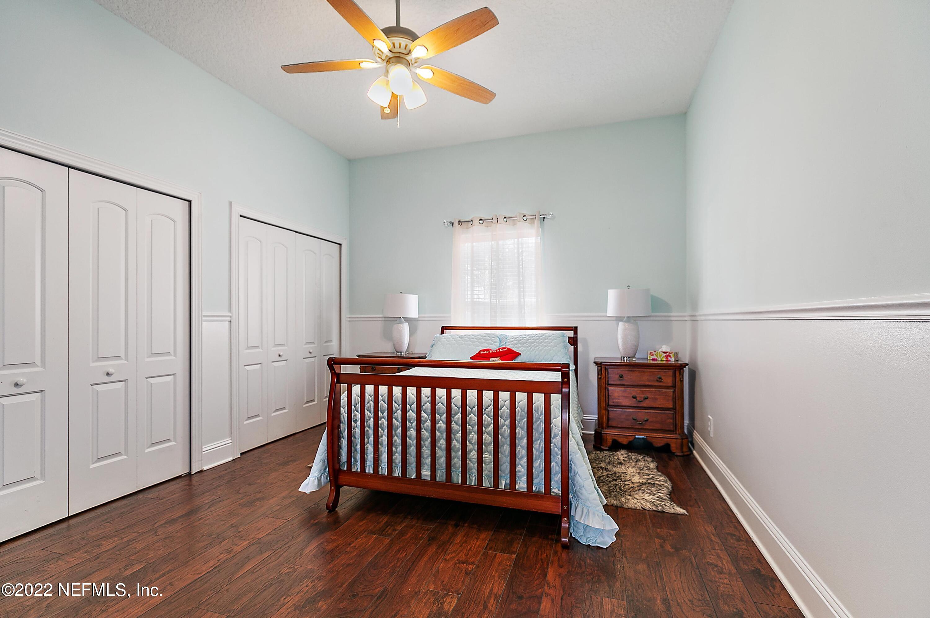 14394 Bob Burnsed Road Glen St. Mary, FL 32040 - Photo 19 of 36 a bedroom with furniture and wooden floor