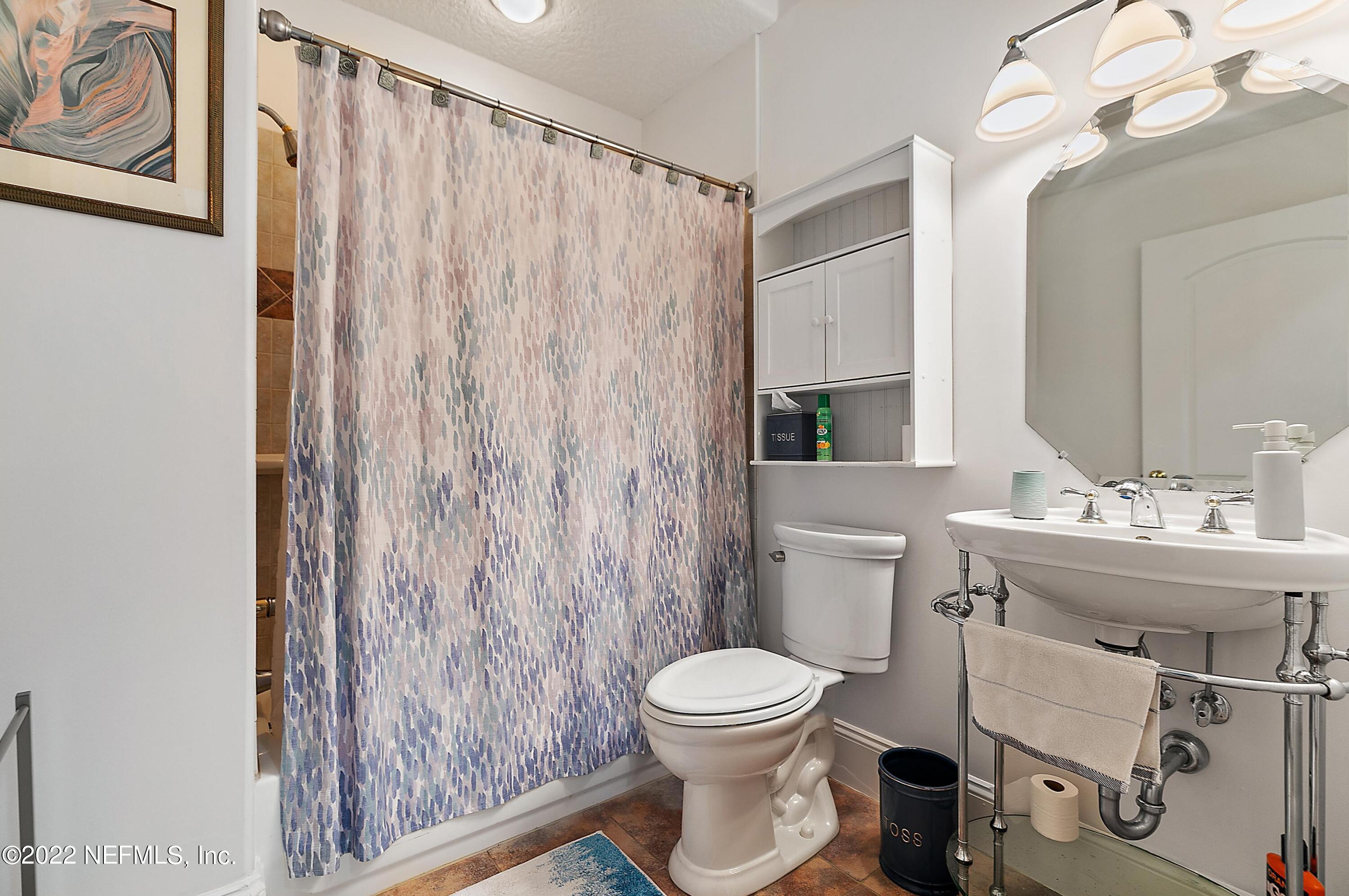 14394 Bob Burnsed Road Glen St. Mary, FL 32040 - Photo 22 of 36 a bathroom with a toilet a sink and a mirror