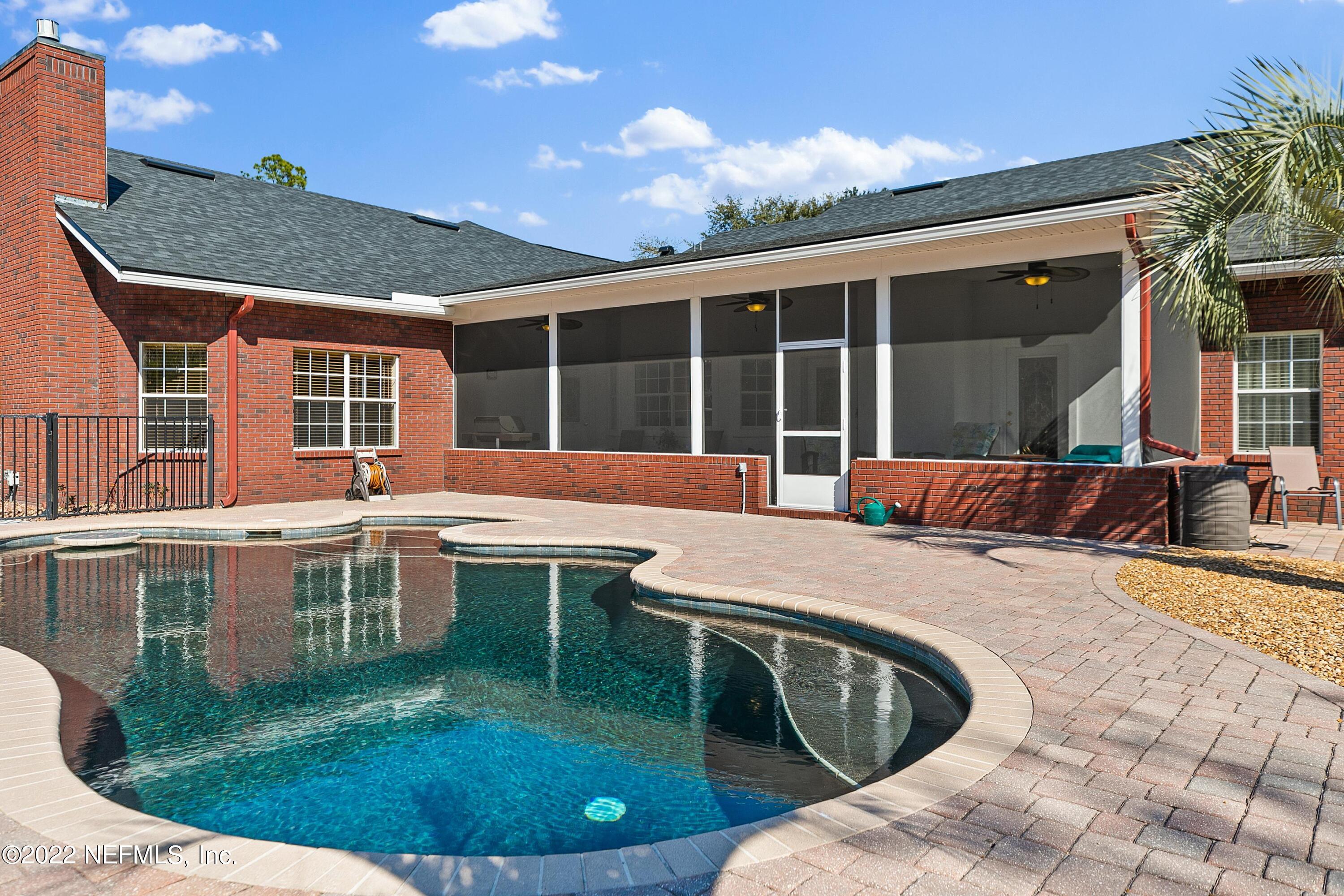 14394 Bob Burnsed Road Glen St. Mary, FL 32040 - Photo 26 of 36 a view of a house with swimming pool and porch