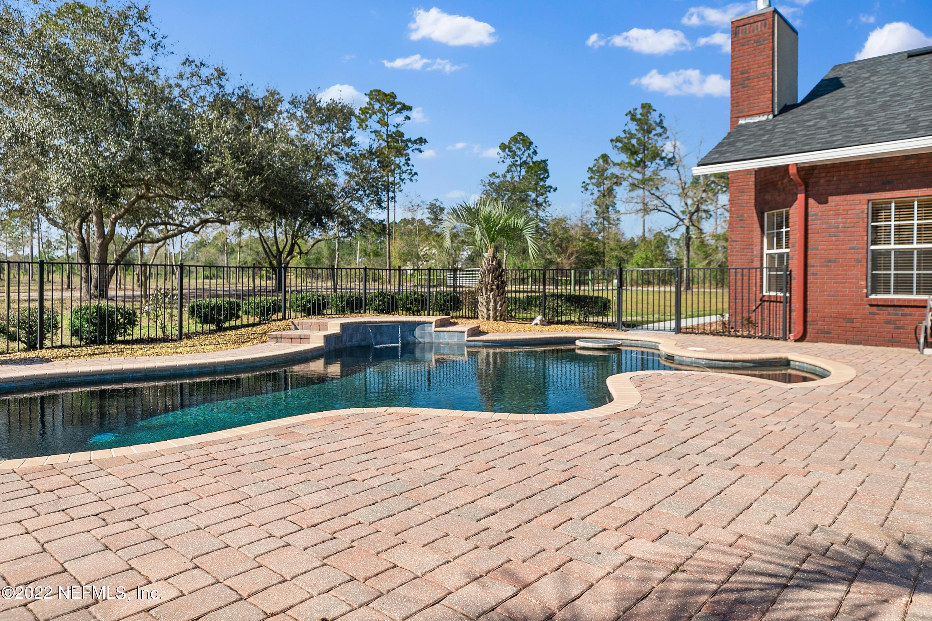 14394 Bob Burnsed Road Glen St. Mary, FL 32040 - Photo 27 of 36 a view of a lake with a yard and potted plants