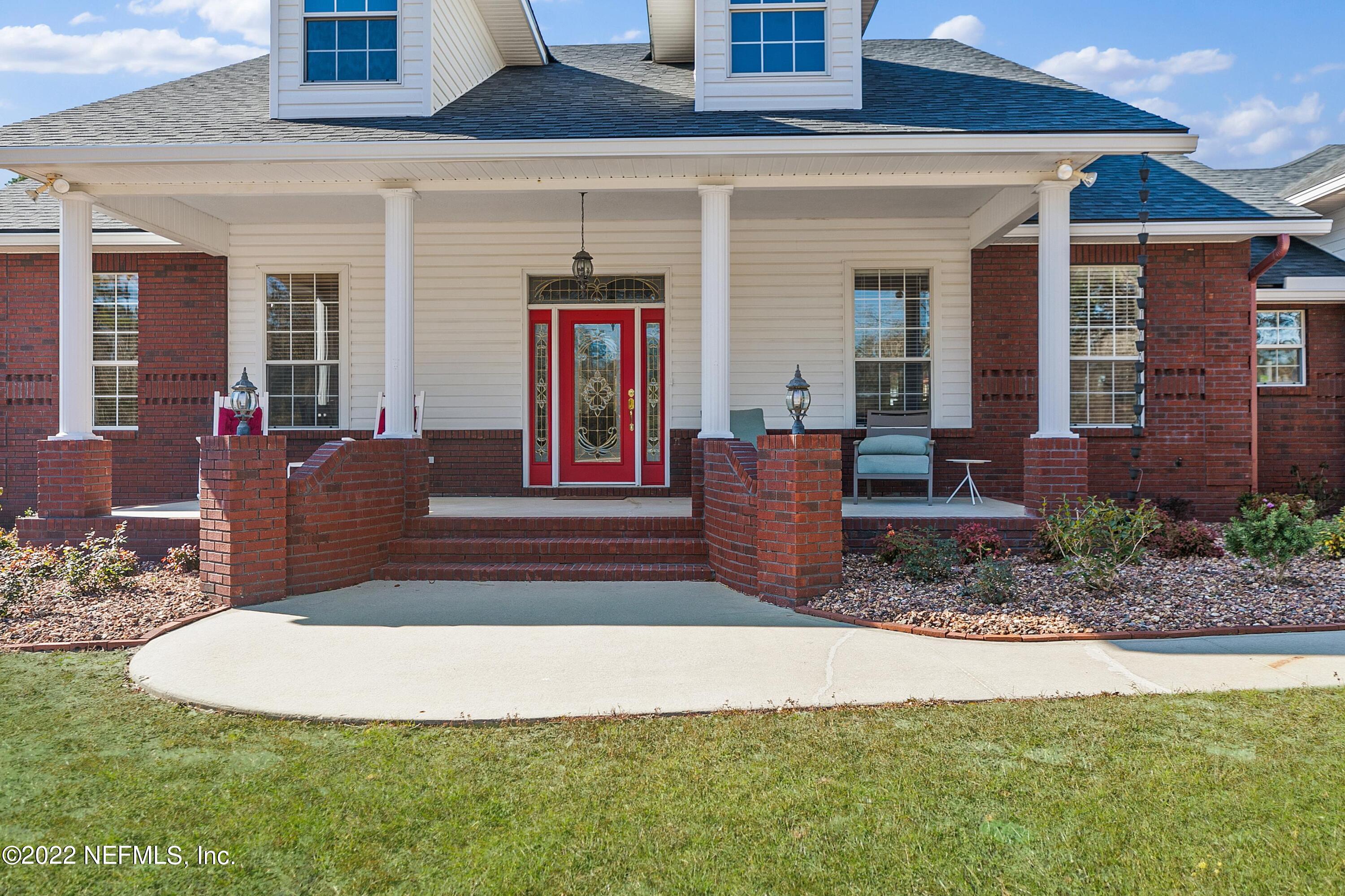 14394 Bob Burnsed Road Glen St. Mary, FL 32040 - Photo 3 of 36 a view of a house with backyard and porch