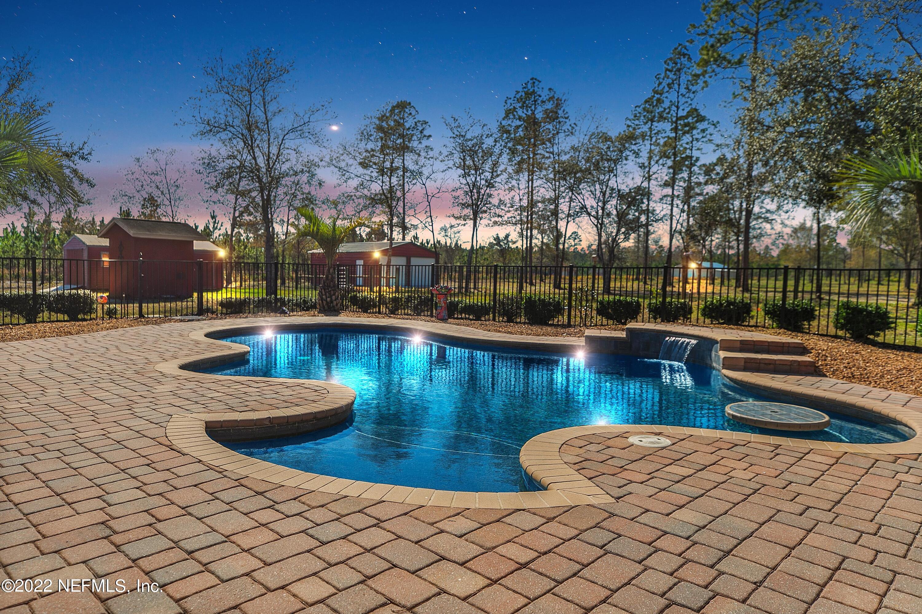 14394 Bob Burnsed Road Glen St. Mary, FL 32040 - Photo 36 of 36 a view of a swimming pool and lounge chair