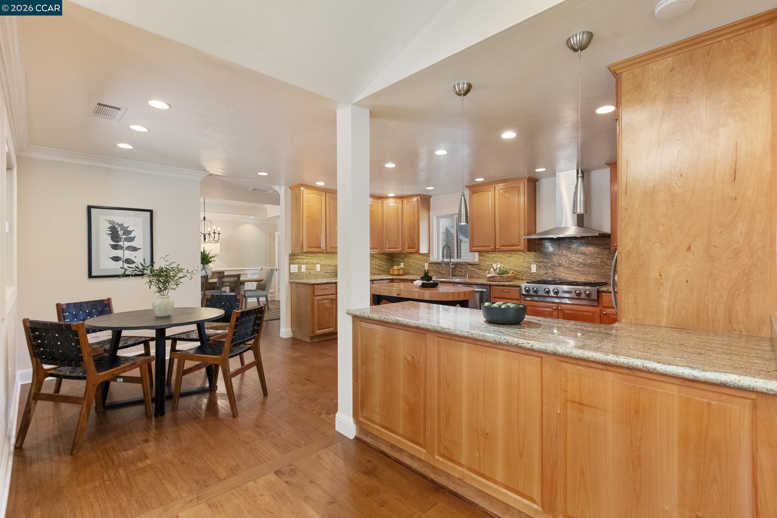 484 Diablo Road Danville, CA 94526 - Photo 17 of 39 a large kitchen with a table and chairs