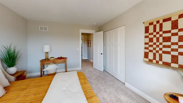 a bedroom with bed and window