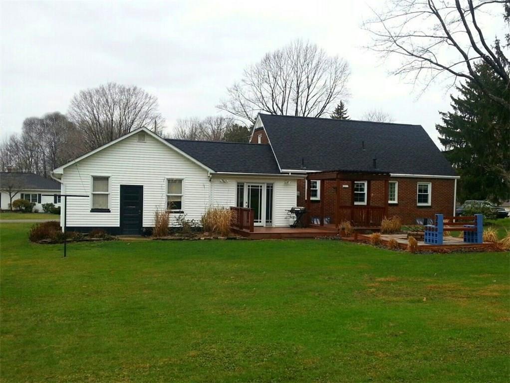 219 Easton Road Hermitage, PA 16148 - Photo 21 of 22 Backyard view of home on .6 acre. Deck, and patio w/fire pit area