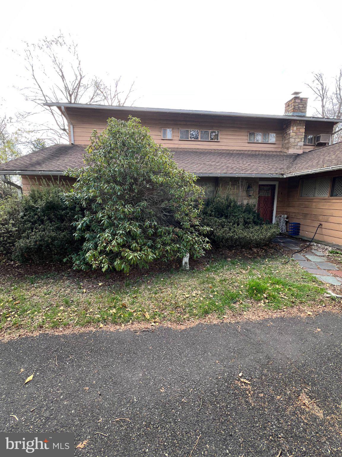 7759 Mellon Road Wyncote, PA 19095 - Photo 2 of 9 Charming home with lush greenery.