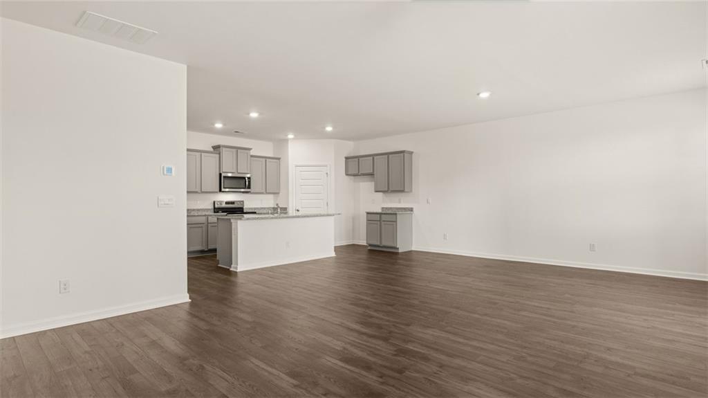 644 Whitman Lane Stockbridge, GA 30281 - Photo 18 of 43 a view of kitchen with wooden floor