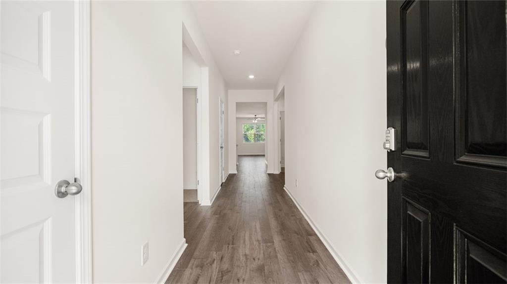 644 Whitman Lane Stockbridge, GA 30281 - Photo 7 of 43 a view of a hallway with wooden floor
