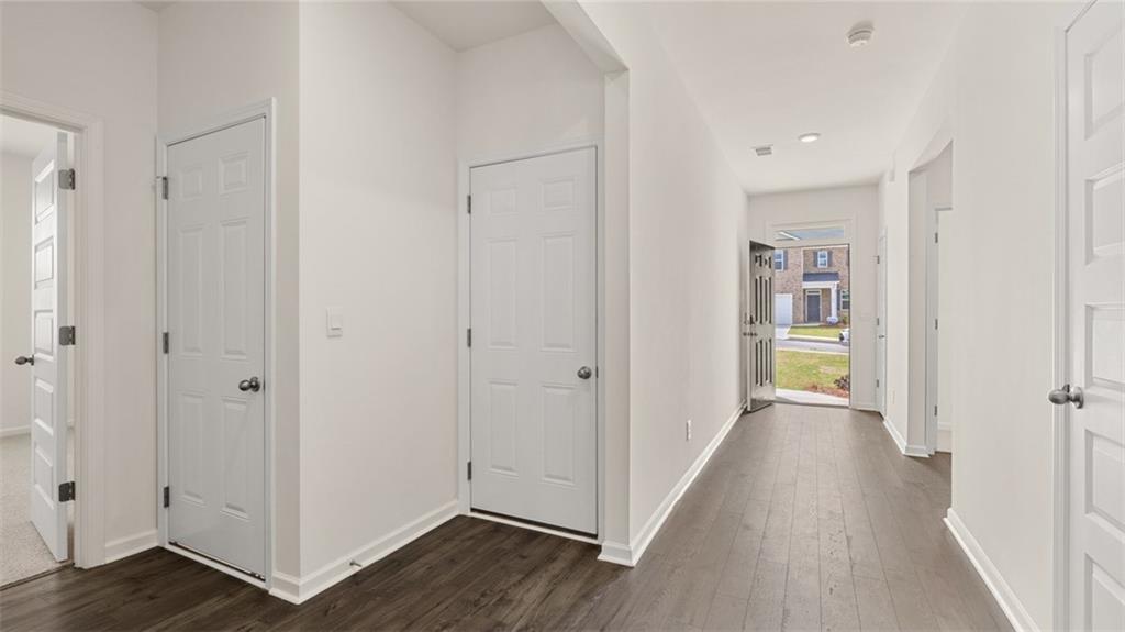 644 Whitman Lane Stockbridge, GA 30281 - Photo 9 of 43 a view of a hallway with wooden floor