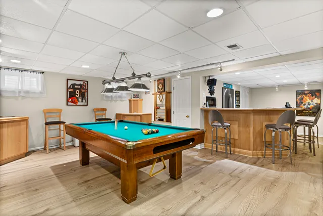 a room with furniture and pool table