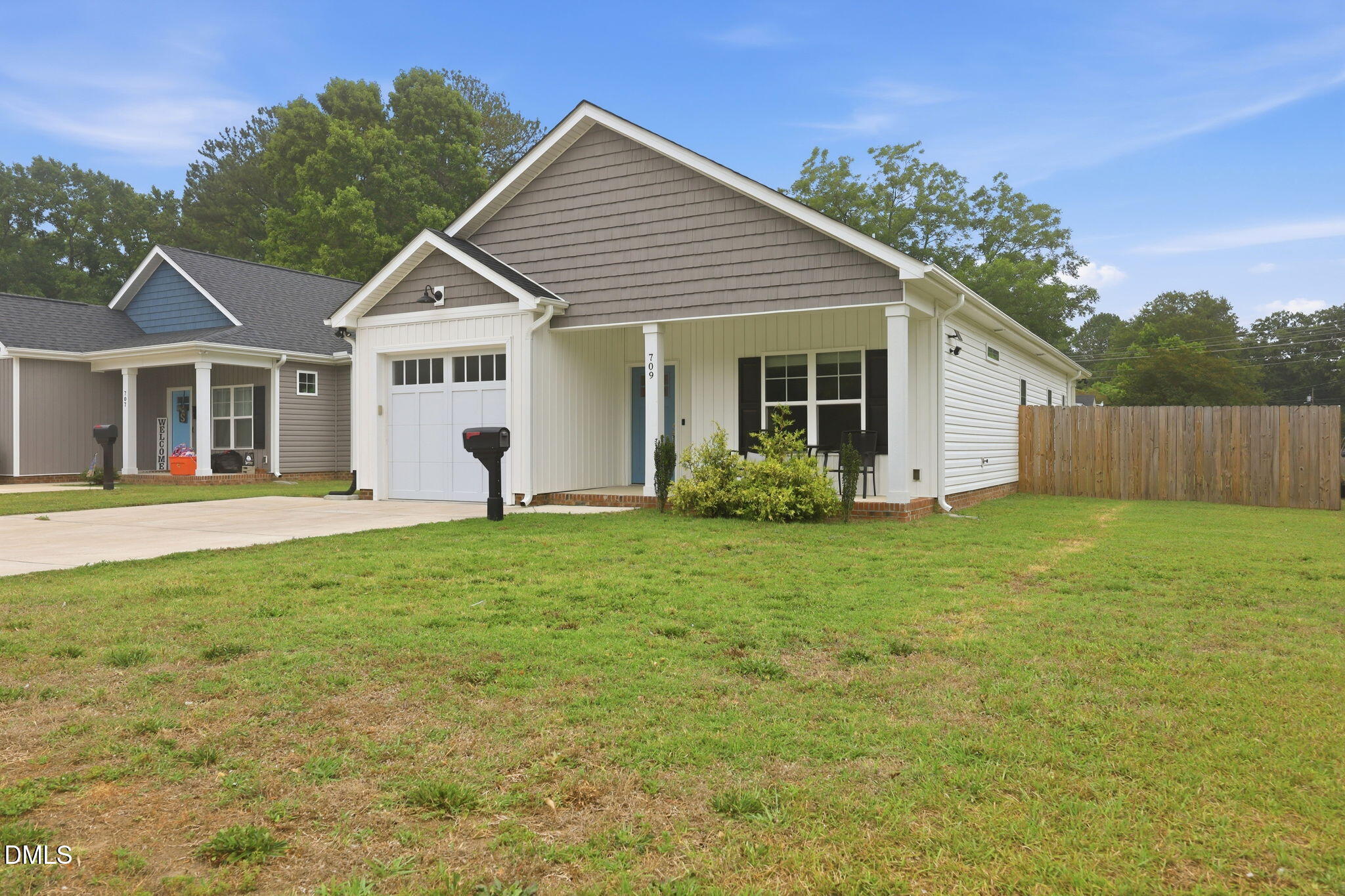 709 South Pollock Street Selma, NC 27576 - Photo 3 of 30 a view of a house with backyard and garden