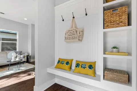 a view of a hallway with couch and front door