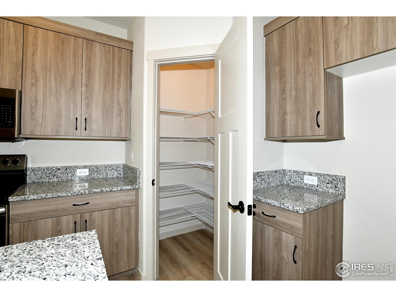 268 East 4th Street Berthoud, CO 80513 - Photo 13 of 39 a bathroom with a granite countertop sink and a cabinet