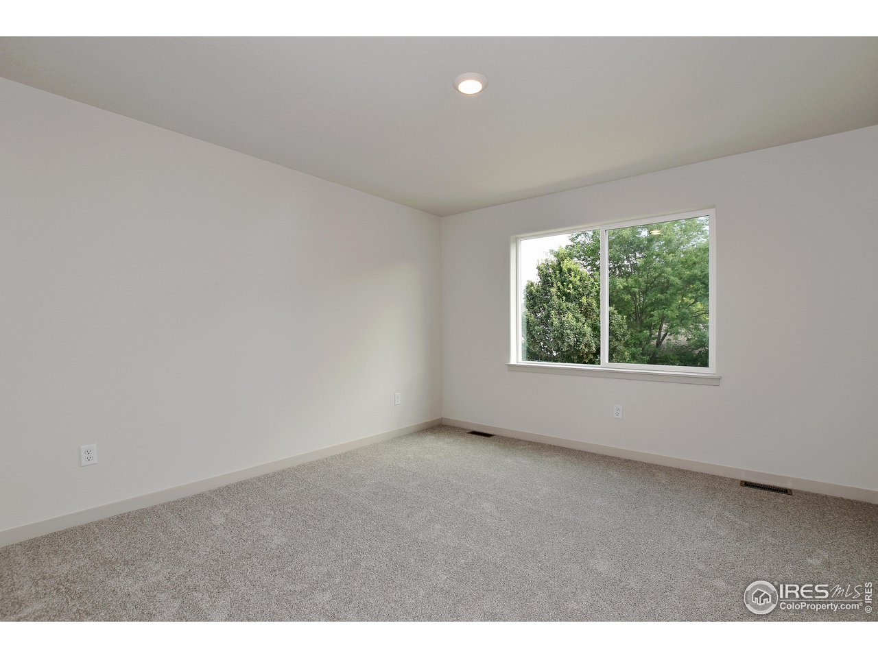 268 East 4th Street Berthoud, CO 80513 - Photo 20 of 39 a view of an empty room with a window