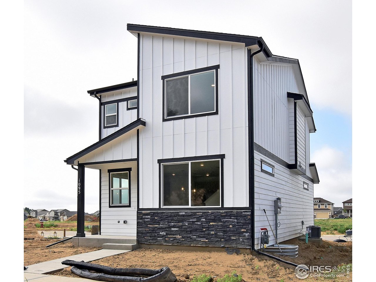 268 East 4th Street Berthoud, CO 80513 - Photo 2 of 39 a front view of a house with stairs
